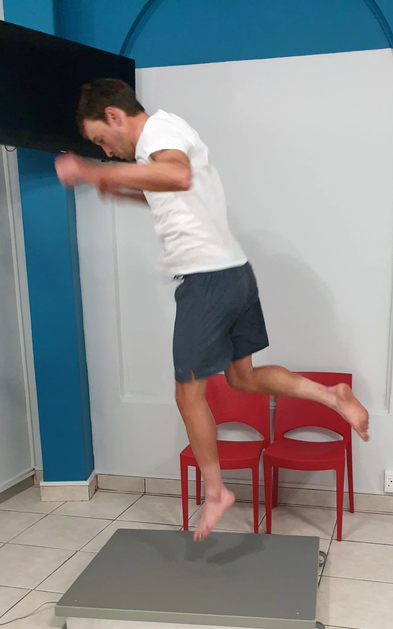 A client performing a jump test on the force plate at The Lab